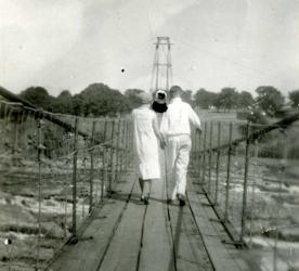 People posing with bridges