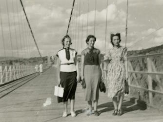 People posing with bridges